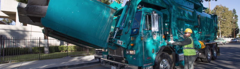 LASAN worker picking up bulky items Image