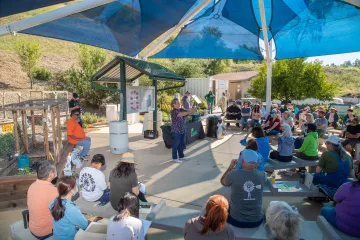 A large crowd gathers for a home composting workshop in Sylmar