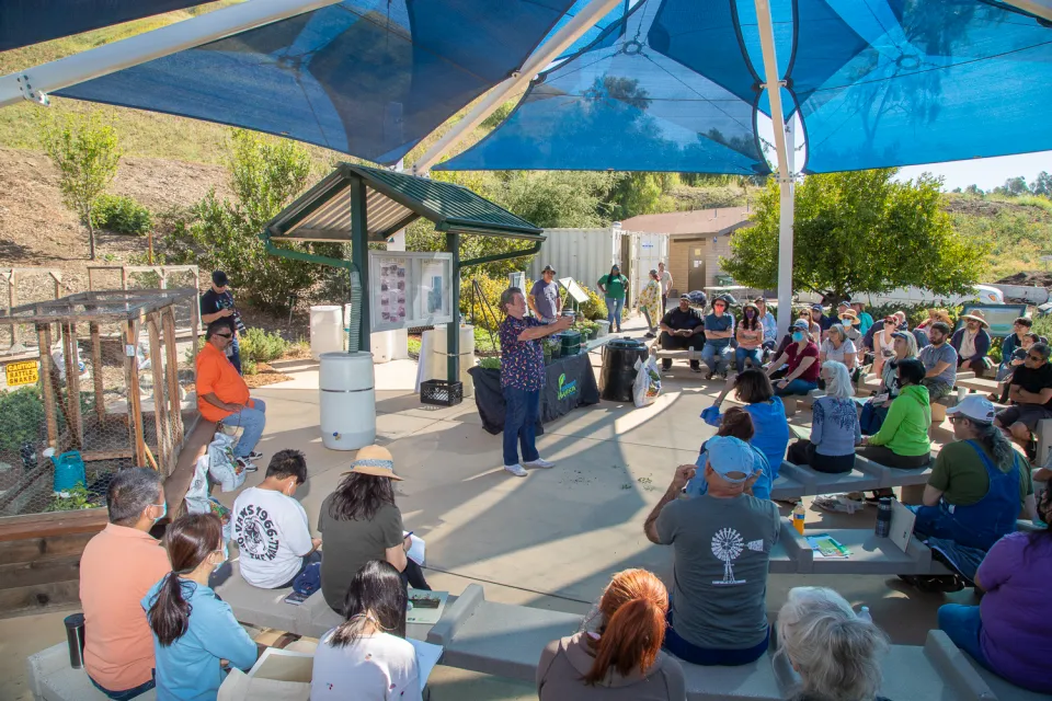A large crowd gathers for a home composting workshop in Sylmar